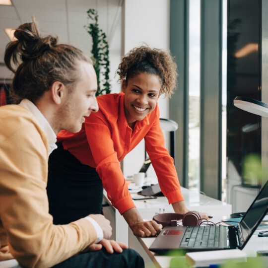 Man and a woman in a meeting.